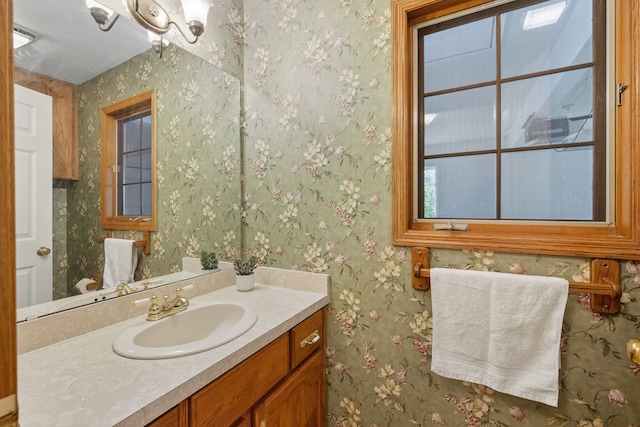 904 54th St, West Des Moines, IA 50266 - bathroom featuring vanity and wallpapered walls