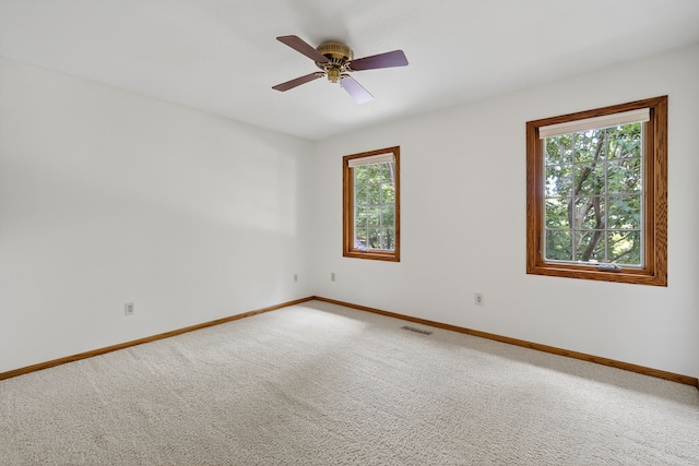 904 54th St, West Des Moines, IA 50266 - carpeted empty room featuring baseboards and a ceiling fan