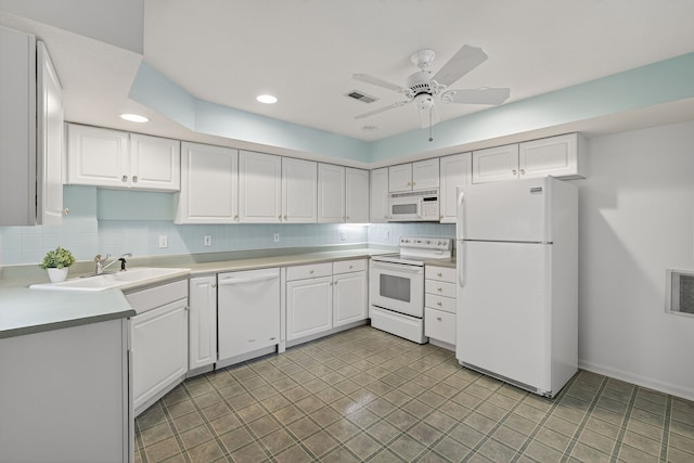 904 54th St, West Des Moines, IA 50266 - kitchen featuring white appliances, white cabinets, backsplash, and recessed lighting