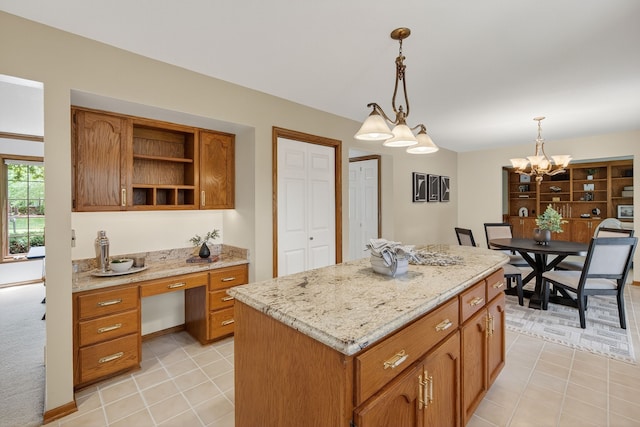 904 54th St, West Des Moines, IA 50266 - kitchen featuring decorative light fixtures, brown cabinets, a kitchen island, open shelves, and light stone countertops