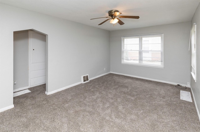 4115 11th St, Des Moines, IA 50313 - carpeted empty room with a ceiling fan and baseboards