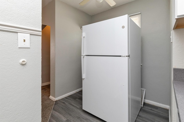 4115 11th St, Des Moines, IA 50313 - kitchen with freestanding refrigerator, wood finished floors, and ceiling fan