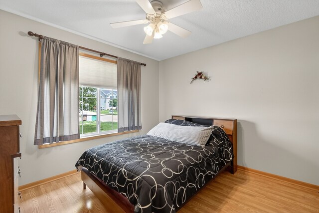 2618 13th St SW, Altoona, IA 50009 - bedroom featuring wood finished floors and ceiling fan