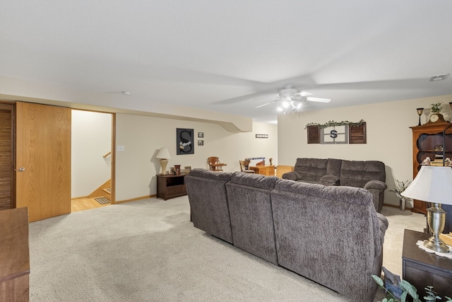 2618 13th St SW, Altoona, IA 50009 - carpeted living area featuring ceiling fan and stairway