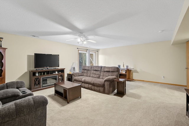 2618 13th St SW, Altoona, IA 50009 - living area with a ceiling fan, light carpet, and a textured ceiling