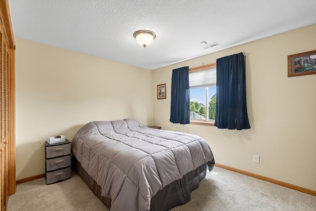 2618 13th St SW, Altoona, IA 50009 - carpeted bedroom with baseboards and a textured ceiling
