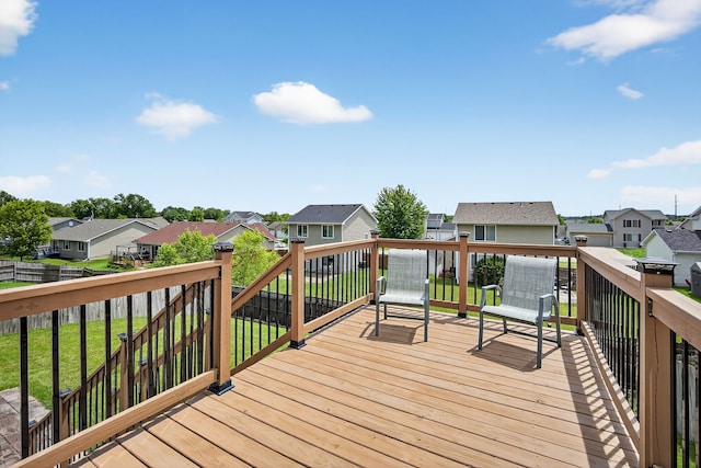 2618 13th St SW, Altoona, IA 50009 - wooden deck featuring a residential view and a yard