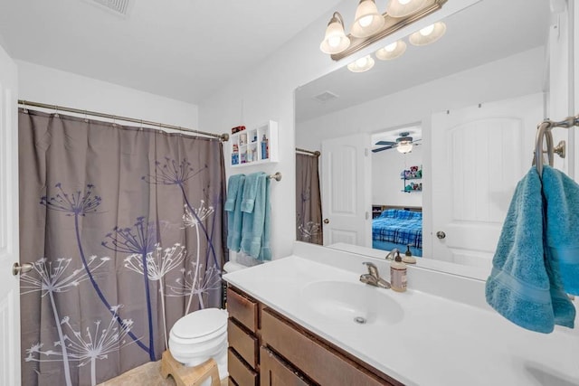 704 36th St SW, Bondurant, IA 50035 - ensuite bathroom featuring vanity, curtained shower, and ceiling fan