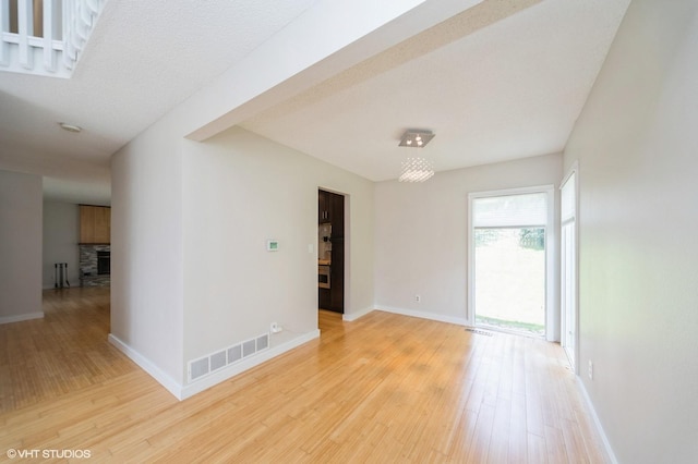 2729 Meadow Point Ct, West Des Moines, IA 50265 - unfurnished room featuring wood finished floors and a fireplace