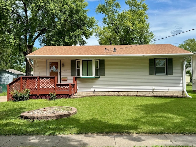 2611 E 38th St, Des Moines, IA 50317 - single story home featuring covered porch, a front yard, and a shingled roof