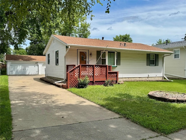 2611 E 38th St, Des Moines, IA 50317 - ranch-style home with a porch, an outdoor structure, a front yard, and a detached garage