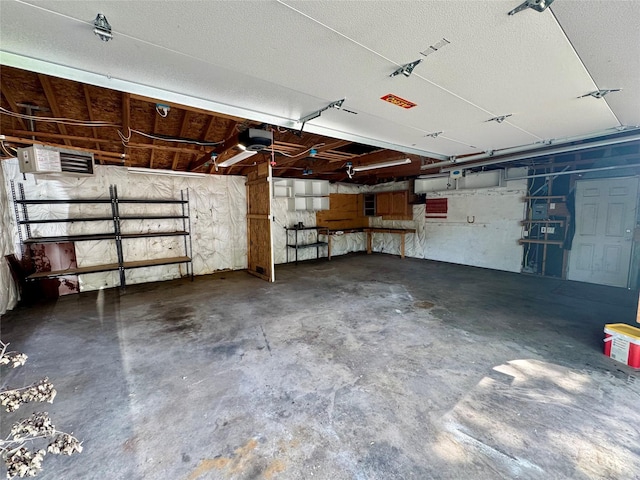 2611 E 38th St, Des Moines, IA 50317 - garage featuring a garage door opener