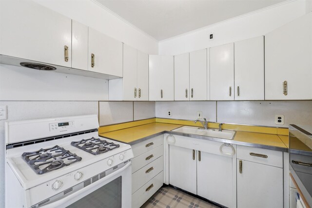 305 Hillside Ave, West Des Moines, IA 50265 - kitchen featuring white range with gas cooktop and light countertops