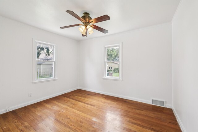 305 Hillside Ave, West Des Moines, IA 50265 - spare room featuring light wood-type flooring, ceiling fan, and crown molding