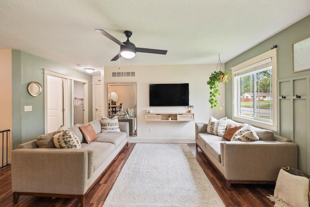 4034 6th Ave, Des Moines, IA 50313 - living area with dark wood finished floors, ceiling fan, and a textured ceiling
