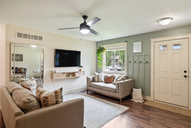 4034 6th Ave, Des Moines, IA 50313 - living room featuring wood finished floors, ceiling fan, and a textured ceiling
