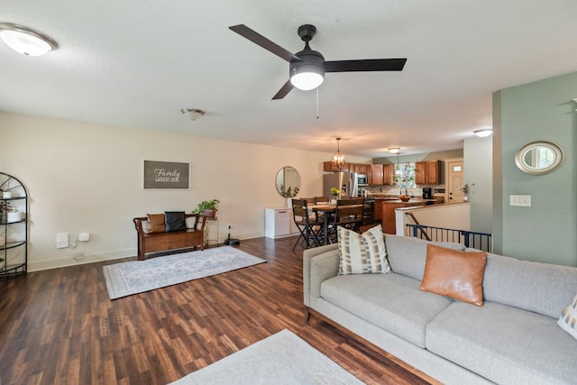 4034 6th Ave, Des Moines, IA 50313 - living room featuring dark wood-style floors and ceiling fan
