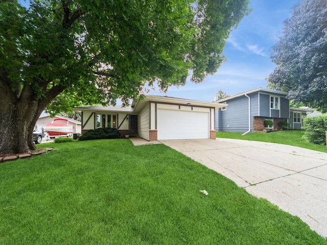 401 NW Valley View Dr, Grimes, IA 50111 - split level home with brick siding, an attached garage, driveway, and a front yard