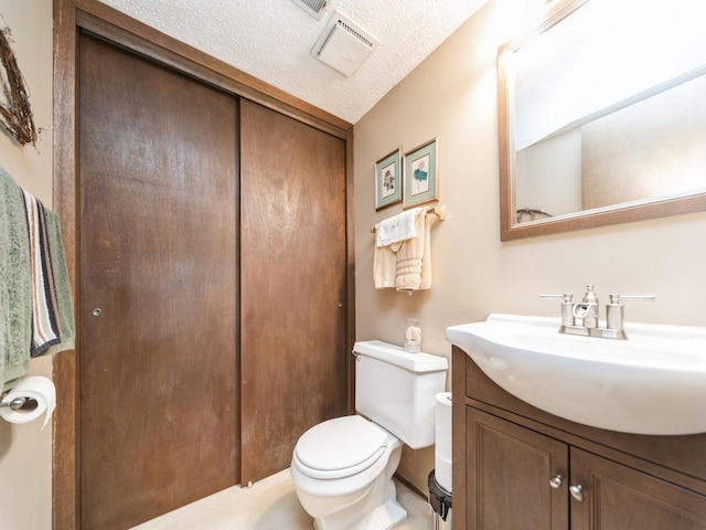 401 NW Valley View Dr, Grimes, IA 50111 - bathroom with vanity and a textured ceiling
