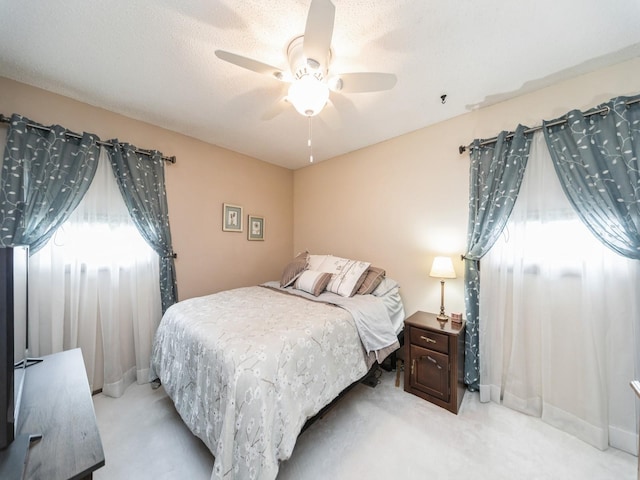 401 NW Valley View Dr, Grimes, IA 50111 - bedroom featuring light colored carpet and ceiling fan