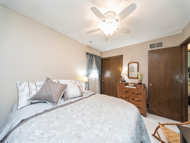 401 NW Valley View Dr, Grimes, IA 50111 - bedroom with carpet flooring, a closet, and a ceiling fan
