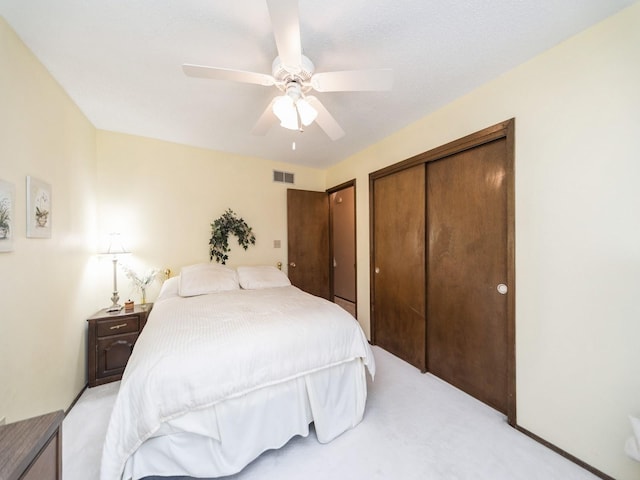 401 NW Valley View Dr, Grimes, IA 50111 - bedroom with light carpet, ceiling fan, and a closet