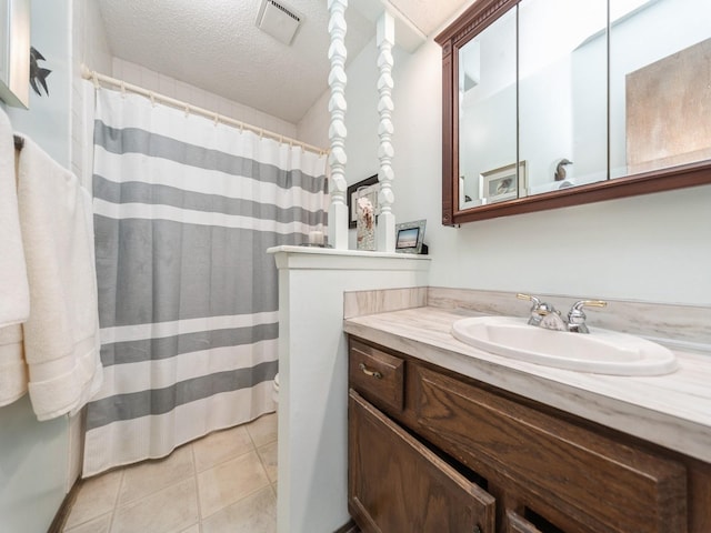 401 NW Valley View Dr, Grimes, IA 50111 - full bathroom featuring vanity, a textured ceiling, tile patterned floors, and a shower with curtain