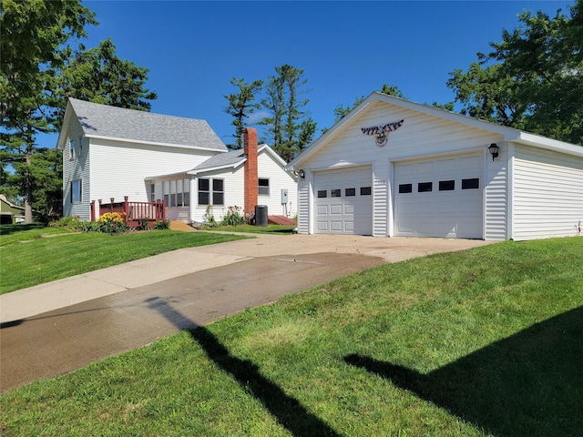 108 W Logan St, Casey, IA 50048 - view of front of home with a garage, an outbuilding, and a front lawn