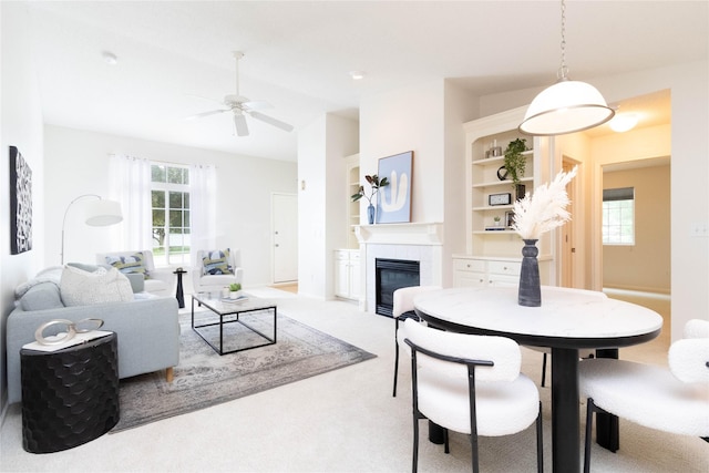 7316 SE 23rd St Unit 5, Des Moines, IA 50320 - living room with a fireplace, ceiling fan, and carpet floors