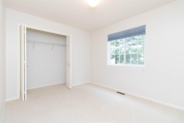 7316 SE 23rd St Unit 5, Des Moines, IA 50320 - unfurnished bedroom featuring carpet flooring and a closet