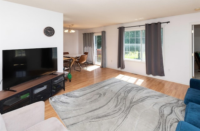 2609 Eagle Point Ct, Des Moines, IA 50320 - living room with a chandelier and wood finished floors