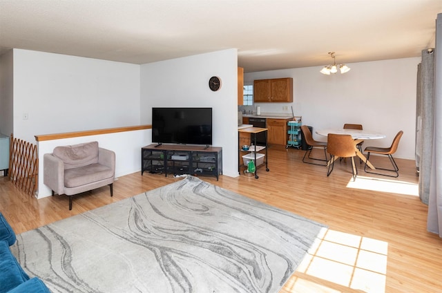 2609 Eagle Point Ct, Des Moines, IA 50320 - living area with a chandelier and light wood-style flooring