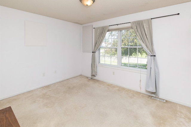 2609 Eagle Point Ct, Des Moines, IA 50320 - spare room with light colored carpet and baseboards