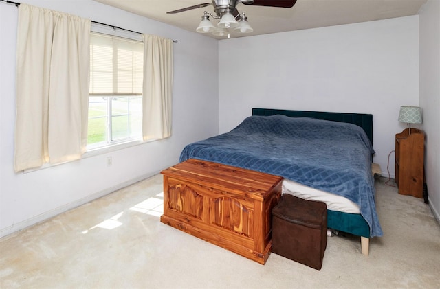 2609 Eagle Point Ct, Des Moines, IA 50320 - carpeted bedroom featuring baseboards and a ceiling fan
