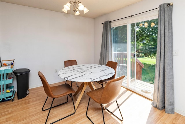 2609 Eagle Point Ct, Des Moines, IA 50320 - dining area featuring light wood-style flooring and a chandelier