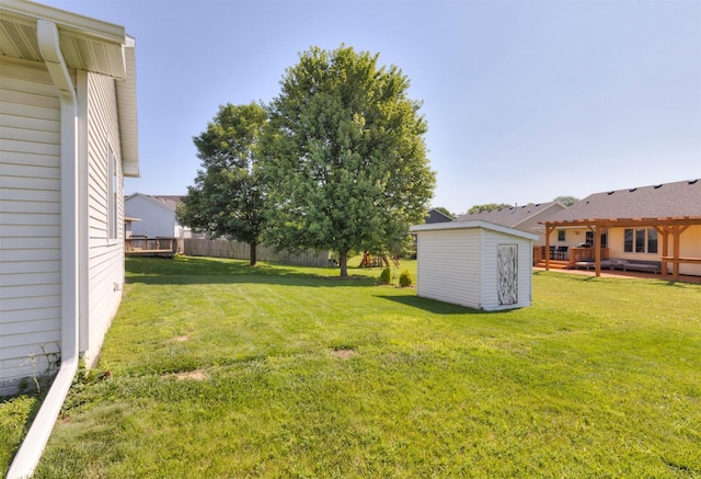 2609 Eagle Point Ct, Des Moines, IA 50320 - view of yard featuring a storage unit and a deck