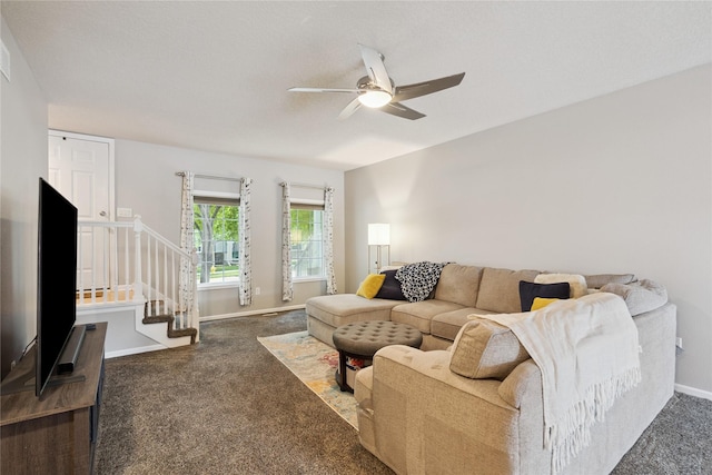 263 SE Booth Ave, Waukee, IA 50266 - living room with carpet flooring, stairway, and a ceiling fan