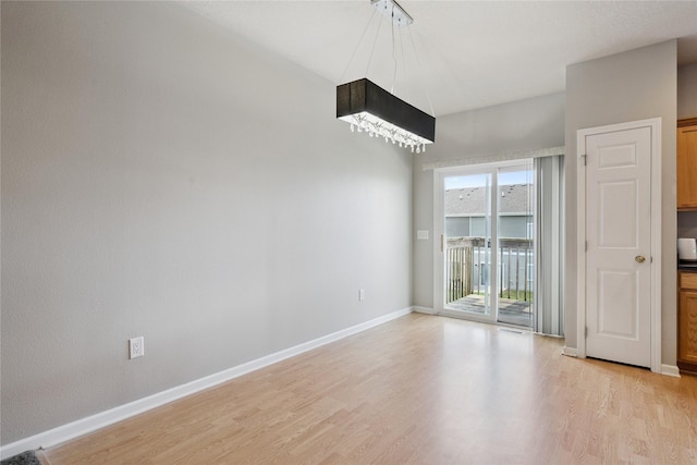 263 SE Booth Ave, Waukee, IA 50266 - empty room with light wood-style flooring and baseboards