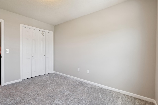 263 SE Booth Ave, Waukee, IA 50266 - unfurnished bedroom featuring carpet and a closet