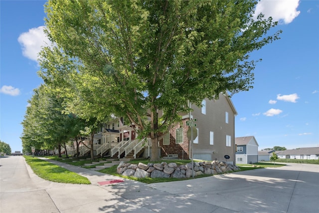 263 SE Booth Ave, Waukee, IA 50266 - view of building exterior featuring a residential view and stairway