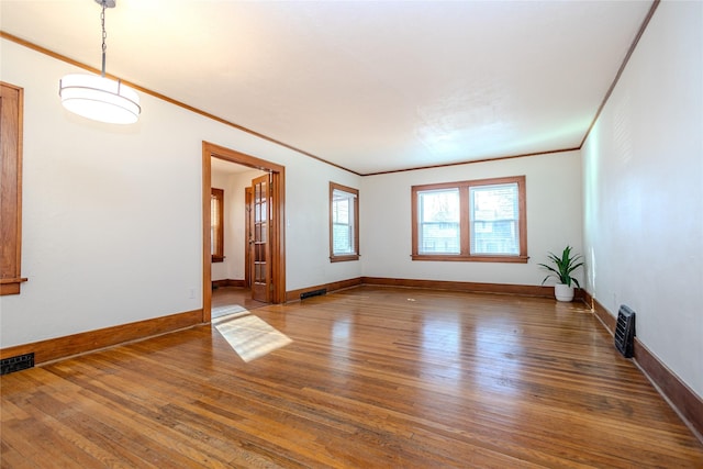 3021 49th St, Des Moines, IA 50310 - spare room featuring hardwood / wood-style flooring and ornamental molding