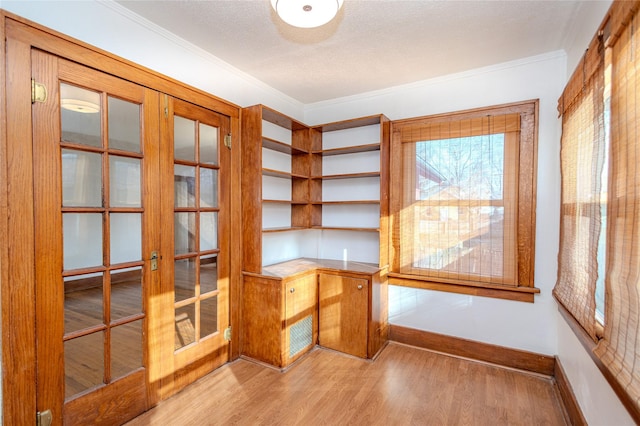 3021 49th St, Des Moines, IA 50310 - unfurnished office featuring french doors, wood finished floors, crown molding, and a textured ceiling