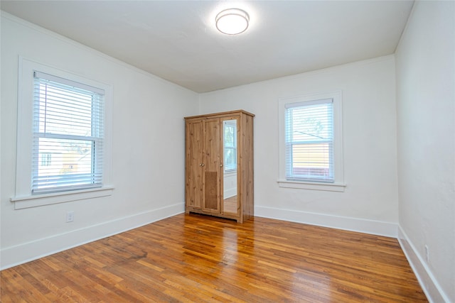 3021 49th St, Des Moines, IA 50310 - unfurnished room featuring wood finished floors and crown molding