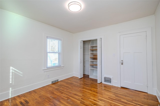 3021 49th St, Des Moines, IA 50310 - unfurnished bedroom featuring light wood-type flooring and ornamental molding