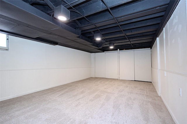 3021 49th St, Des Moines, IA 50310 - finished basement with light colored carpet and wainscoting