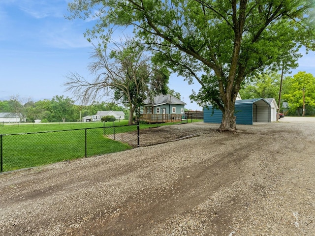 715 N Fremont St, Stuart, IA 50250 - view of front of home featuring a carport and dirt driveway