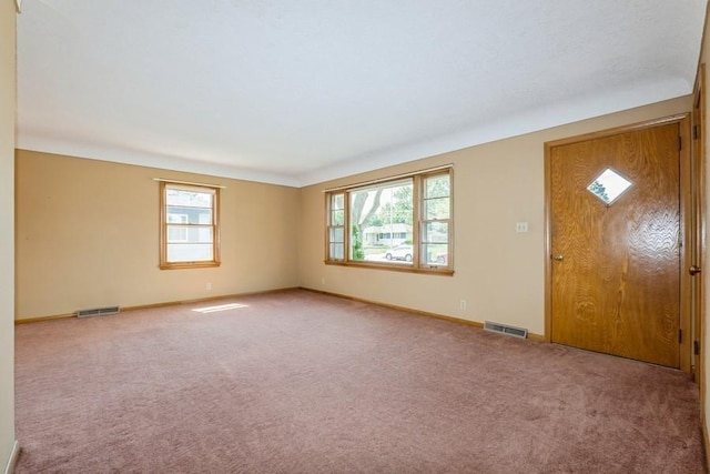 7210 Beechwood Dr, Urbandale, IA 50322 - entrance foyer with baseboards and carpet floors
