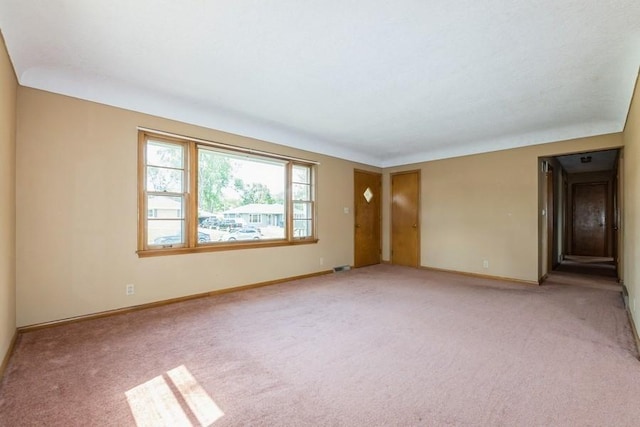 7210 Beechwood Dr, Urbandale, IA 50322 - empty room featuring light carpet