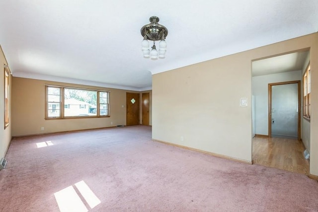 7210 Beechwood Dr, Urbandale, IA 50322 - unfurnished room featuring light colored carpet and baseboards