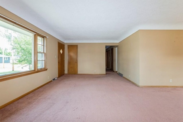 7210 Beechwood Dr, Urbandale, IA 50322 - spare room featuring light colored carpet